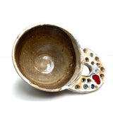 Rainbow bowl with pierced handle